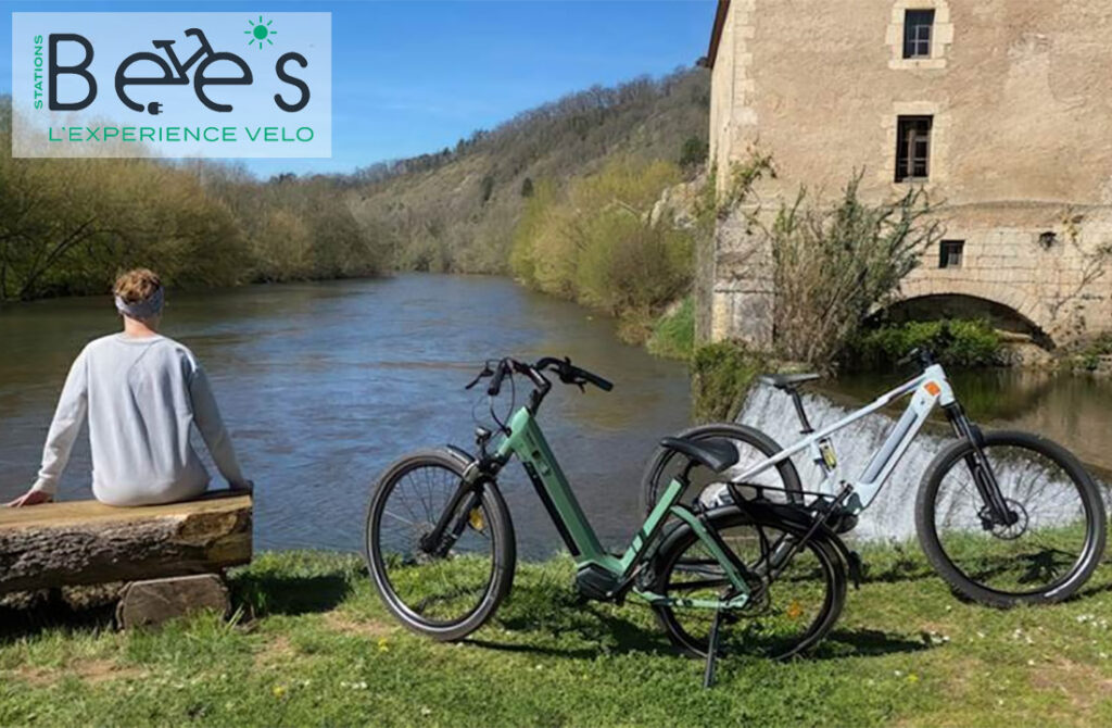 Bicycle rental near lush river scenery in Dordogne.
