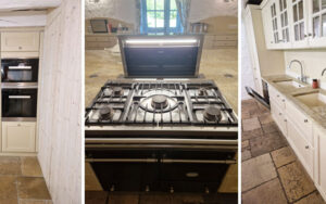 Moderne keuken in luxe vakantiehuis met witte kasten en granieten werkblad.