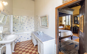 Suite bathroom with vintage decor and classic fixtures in a charming Dordogne holiday home.
