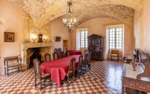 Elegant Dordogne villa with historic interior and spacious dining area.