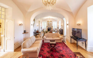 Elegant living room in a luxury Dordogne holiday house with classic decor and spacious layout.