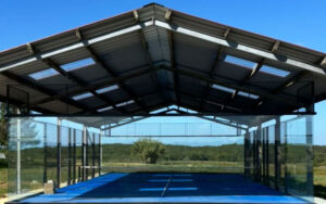 Modern tennis court at luxury Dordogne vacation home.