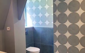 Luxury Dordogne holiday home bathroom with stylish circular tile design.