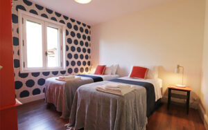 Cozy bedroom in luxury Dordogne holiday home with stylish decor and modern amenities.