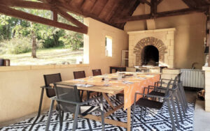Charming outdoor dining area in a luxury Dordogne holiday home.